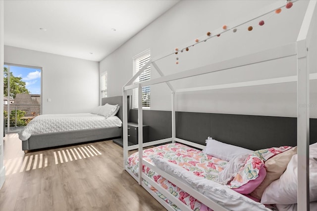 1521 Chestnut Ave, Winter Park, FL 32789 - bedroom with wood finished floors and access to outside