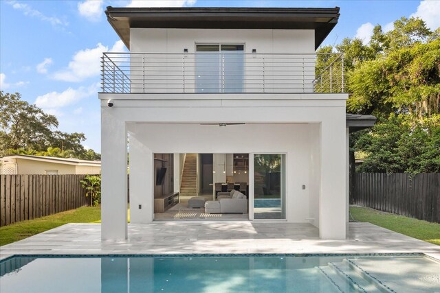 1521 Chestnut Ave, Winter Park, FL 32789 - rear view of property with a balcony, a fenced backyard, a patio, and stucco siding