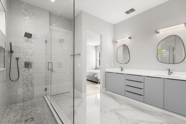 1521 Chestnut Ave, Winter Park, FL 32789 - bathroom with a shower stall, double vanity, marble finish floors, and ensuite bathroom