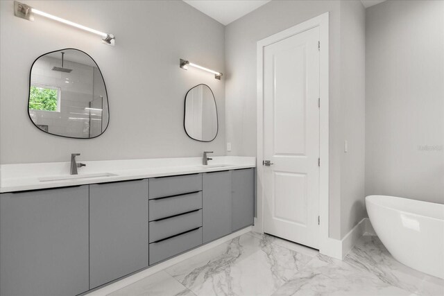 1521 Chestnut Ave, Winter Park, FL 32789 - full bathroom with marble look tiles, double vanity, a soaking tub, baseboards, and a shower