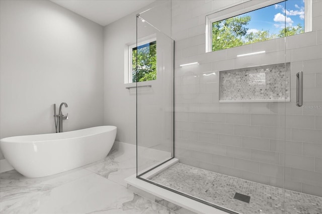1521 Chestnut Ave, Winter Park, FL 32789 - full bathroom featuring marble tiled flooring, tiled shower, and a freestanding tub