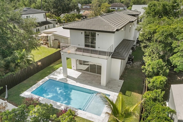 1521 Chestnut Ave, Winter Park, FL 32789 - rear view of house with a balcony, a patio area, and stucco siding