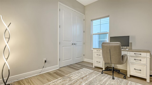 office with light wood finished floors and baseboards