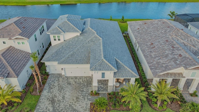 aerial view of property and surrounding area with a large body of water