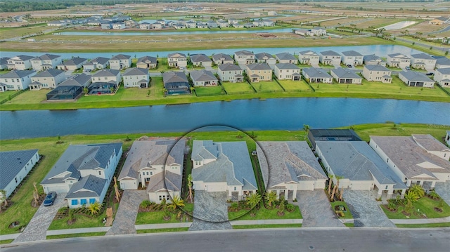 aerial perspective of suburban area with a large body of water