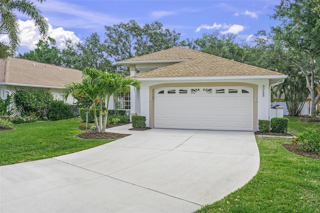 3263 Woodberry Ln Lot 15, Sarasota, FL 34231 - view of front facade with stucco siding, concrete driveway, an attached garage, a front yard, and a shingled roof