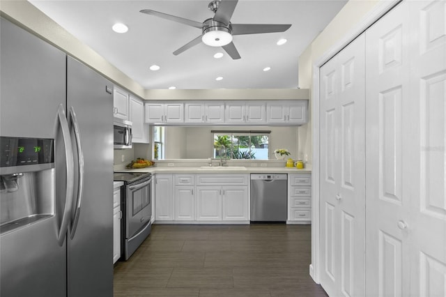 3263 Woodberry Ln Lot 15, Sarasota, FL 34231 - kitchen featuring appliances with stainless steel finishes, a sink, light countertops, white cabinetry, and a ceiling fan