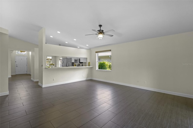 3263 Woodberry Ln Lot 15, Sarasota, FL 34231 - unfurnished living room featuring ceiling fan, recessed lighting, wood tiled floors, and baseboards