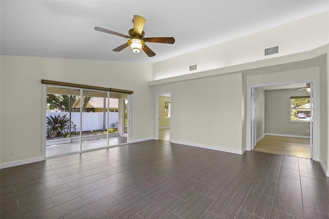 3263 Woodberry Ln Lot 15, Sarasota, FL 34231 - empty room featuring a ceiling fan, healthy amount of natural light, and dark wood-type flooring