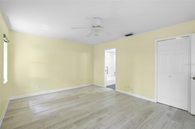 3263 Woodberry Ln Lot 15, Sarasota, FL 34231 - empty room featuring a ceiling fan, light wood-style floors, and baseboards