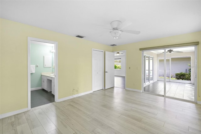 3263 Woodberry Ln Lot 15, Sarasota, FL 34231 - unfurnished bedroom with baseboards, light wood-type flooring, access to outside, ensuite bath, and a ceiling fan