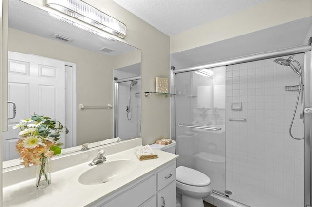 3263 Woodberry Ln Lot 15, Sarasota, FL 34231 - full bathroom featuring a stall shower, toilet, vanity, and a textured ceiling