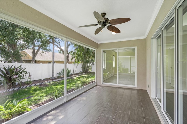 3263 Woodberry Ln Lot 15, Sarasota, FL 34231 - unfurnished sunroom featuring ceiling fan and crown molding