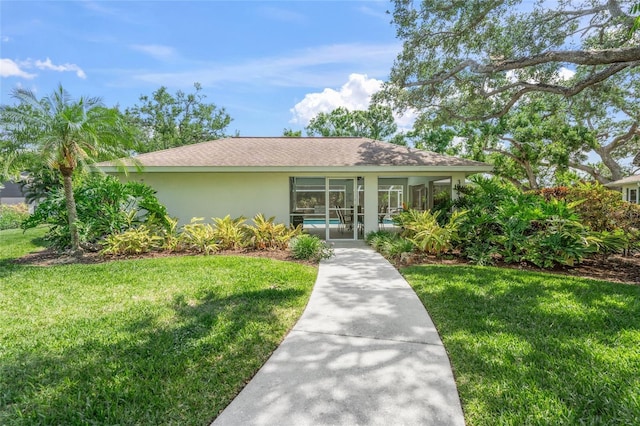 3263 Woodberry Ln Lot 15, Sarasota, FL 34231 - view of front of house featuring stucco siding, a front yard, and a shingled roof