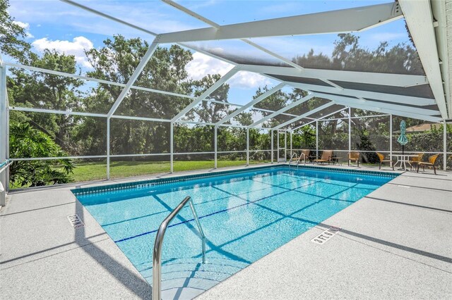3263 Woodberry Ln Lot 15, Sarasota, FL 34231 - outdoor pool with a patio area, view of scattered trees, and a lanai