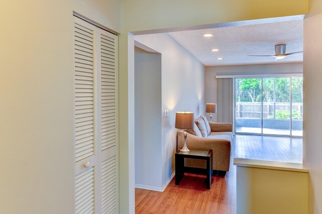 7719 9th Avenue Dr NW, Bradenton, FL 34209 - sitting room with light wood-style flooring, baseboards, recessed lighting, and a textured ceiling