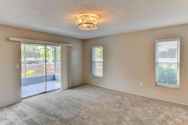 7719 9th Avenue Dr NW, Bradenton, FL 34209 - unfurnished room featuring carpet floors, a textured ceiling, and baseboards