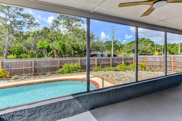 7719 9th Avenue Dr NW, Bradenton, FL 34209 - view of pool with a ceiling fan and view of wooded area