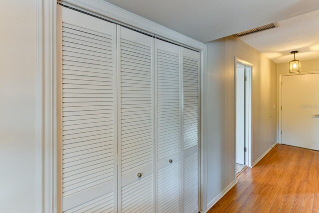 7719 9th Avenue Dr NW, Bradenton, FL 34209 - hall with light wood-style flooring and baseboards