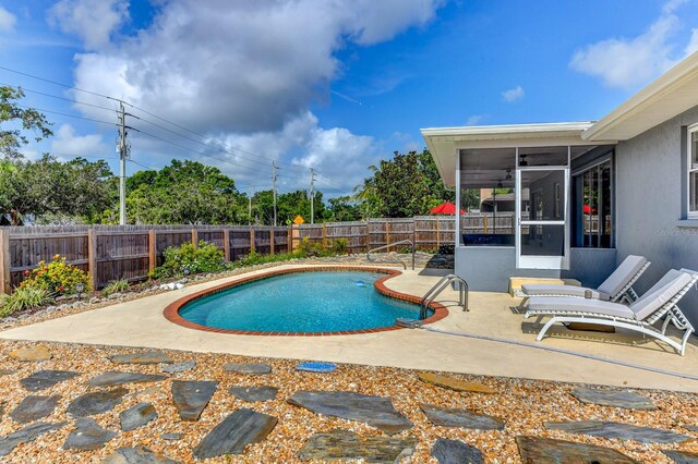 7719 9th Avenue Dr NW, Bradenton, FL 34209 - view of pool with a sunroom, a fenced backyard, and a patio