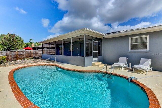 7719 9th Avenue Dr NW, Bradenton, FL 34209 - view of swimming pool with a sunroom, a patio, and ceiling fan