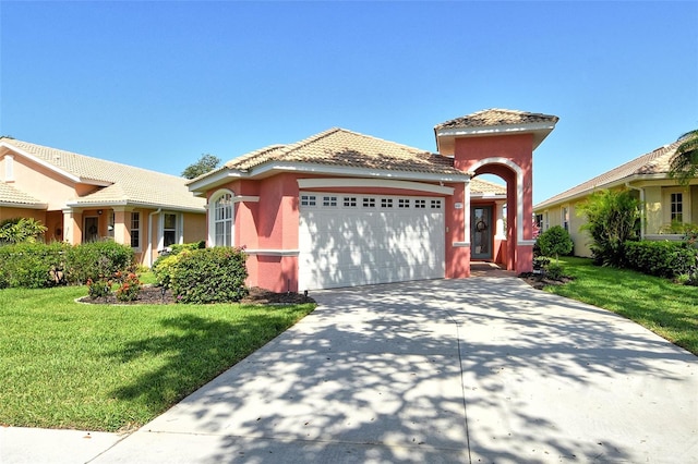 4322 Reflections Pkwy, Sarasota, FL 34233 - mediterranean / spanish-style house with a garage, stucco siding, a front lawn, concrete driveway, and a tiled roof