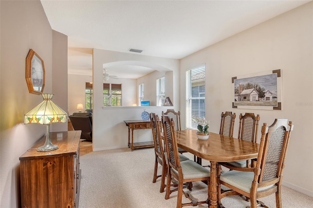 4322 Reflections Pkwy, Sarasota, FL 34233 - dining space with healthy amount of natural light, light colored carpet, and baseboards