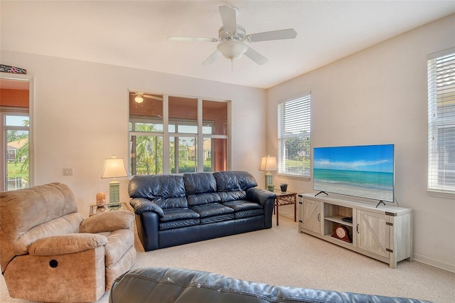 4322 Reflections Pkwy, Sarasota, FL 34233 - living room with carpet floors, ceiling fan, plenty of natural light, and baseboards