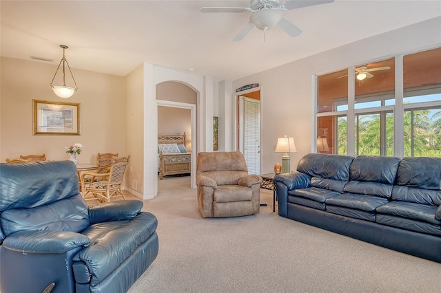 4322 Reflections Pkwy, Sarasota, FL 34233 - living area featuring light carpet, ceiling fan, and baseboards