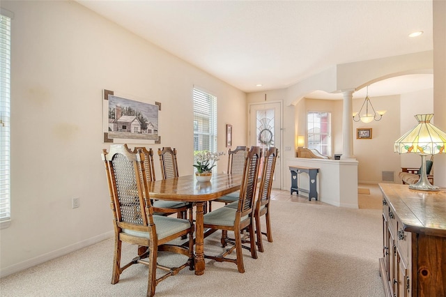 4322 Reflections Pkwy, Sarasota, FL 34233 - dining room featuring arched walkways, light carpet, plenty of natural light, and recessed lighting
