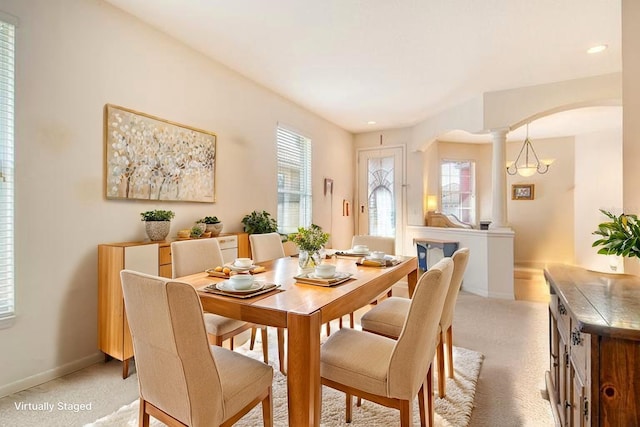 4322 Reflections Pkwy, Sarasota, FL 34233 - dining area featuring arched walkways, light carpet, plenty of natural light, recessed lighting, and ornate columns