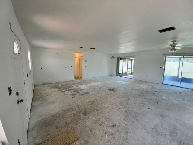 2188 Corinne Ct S Unit A, Saint Petersburg, FL 33712 - spare room featuring unfinished concrete floors and ceiling fan