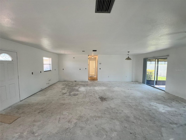 2188 Corinne Ct S Unit A, Saint Petersburg, FL 33712 - unfurnished living room with unfinished concrete floors