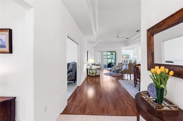 315 Heritage Isles Way, Bradenton, FL 34212 - hallway featuring crown molding, baseboards, and wood finished floors