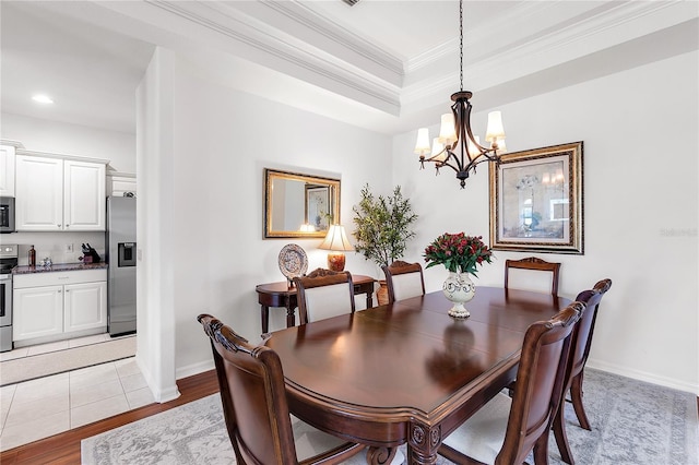 315 Heritage Isles Way, Bradenton, FL 34212 - dining area featuring crown molding, a chandelier, recessed lighting, light wood finished floors, and baseboards