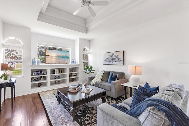 315 Heritage Isles Way, Bradenton, FL 34212 - living area featuring crown molding, a tray ceiling, a ceiling fan, dark wood-type flooring, and baseboards