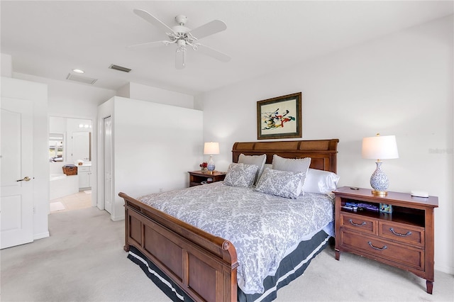 315 Heritage Isles Way, Bradenton, FL 34212 - bedroom with light colored carpet, ensuite bath, a closet, ceiling fan, and recessed lighting