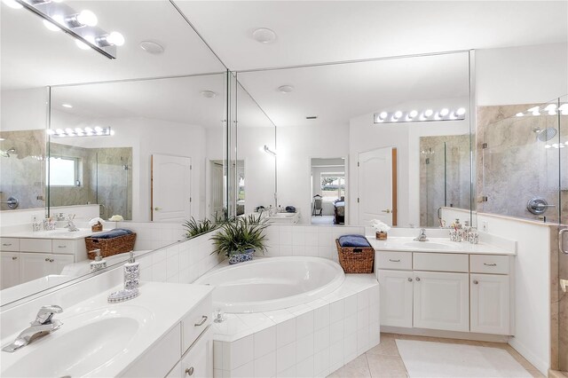 315 Heritage Isles Way, Bradenton, FL 34212 - full bathroom featuring a stall shower, a bath, tile patterned floors, and plenty of natural light