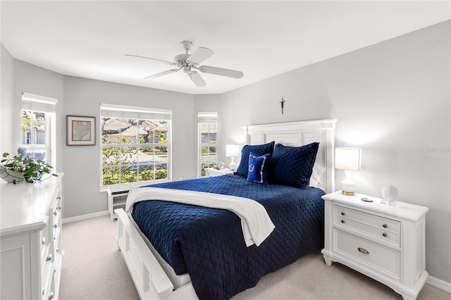 315 Heritage Isles Way, Bradenton, FL 34212 - bedroom featuring light colored carpet, baseboards, and a ceiling fan