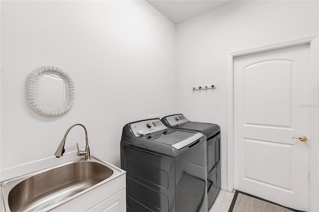 315 Heritage Isles Way, Bradenton, FL 34212 - laundry area with washing machine and dryer and light tile patterned floors
