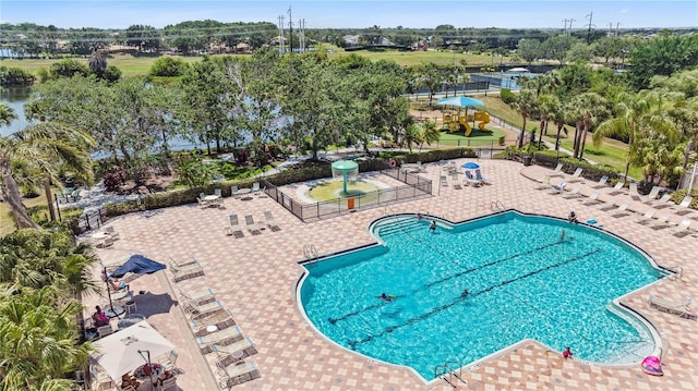 315 Heritage Isles Way, Bradenton, FL 34212 - community pool with fence, a patio area, and view of scattered trees