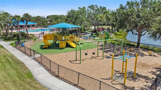 315 Heritage Isles Way, Bradenton, FL 34212 - communal playground with fence and view of wooded area