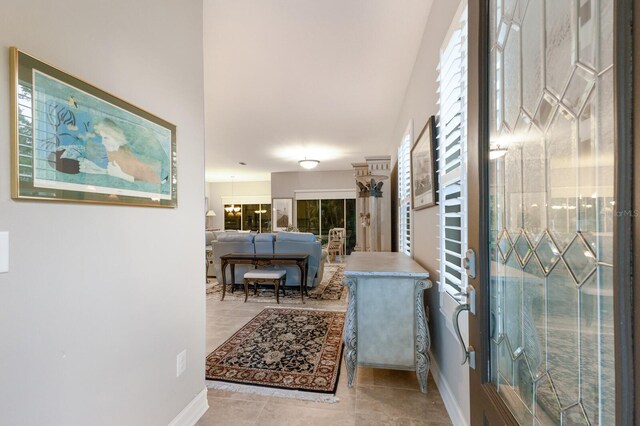 hallway featuring baseboards