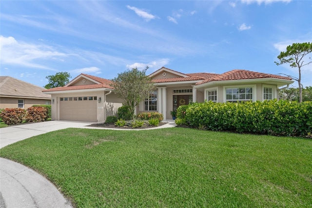 6664 Deering Cir, Sarasota, FL 34240 - mediterranean / spanish house with a tile roof, an attached garage, driveway, stucco siding, and a front lawn