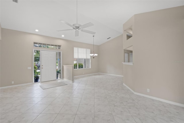 6664 Deering Cir, Sarasota, FL 34240 - spare room featuring a chandelier, a ceiling fan, baseboards, recessed lighting, and high vaulted ceiling