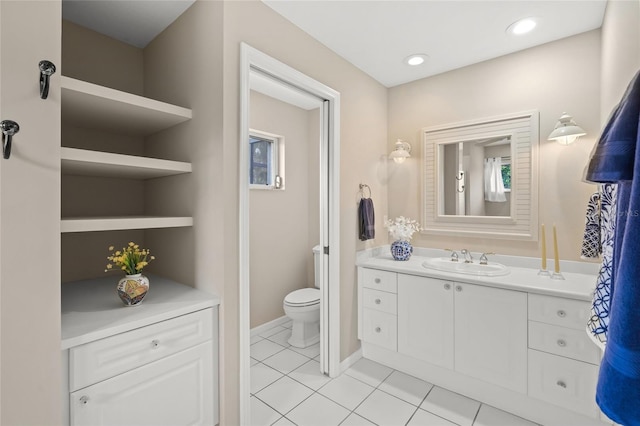 6664 Deering Cir, Sarasota, FL 34240 - bathroom featuring vanity, toilet, tile patterned floors, and baseboards