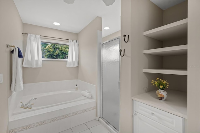 6664 Deering Cir, Sarasota, FL 34240 - bathroom with a bath, a shower stall, and tile patterned flooring