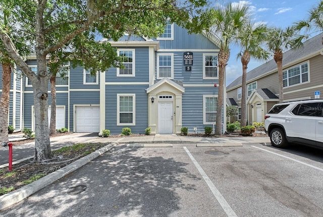 5681 Bidwell Pkwy Unit 102, Sarasota, FL 34233 - multi unit property featuring uncovered parking and board and batten siding