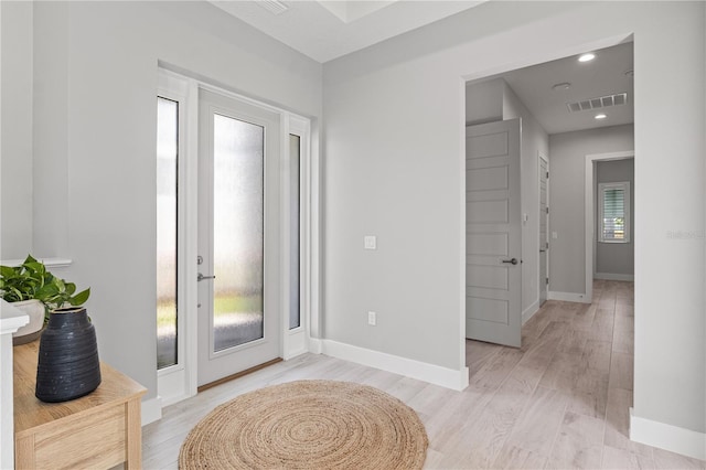 5910 Red Mangrove Ln, Bradenton, FL 34210 - foyer entrance with baseboards and light wood finished floors