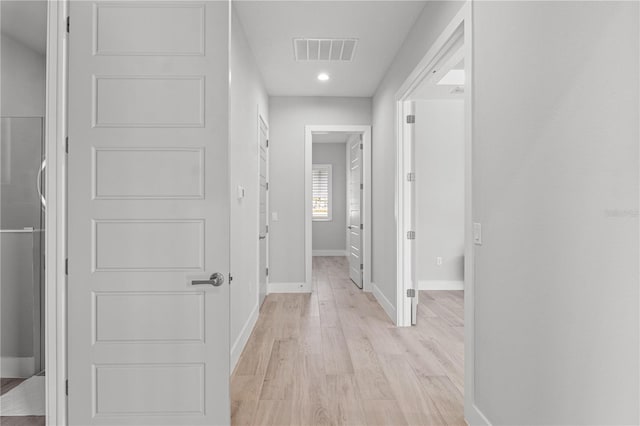 5910 Red Mangrove Ln, Bradenton, FL 34210 - hall featuring baseboards, light wood finished floors, and recessed lighting